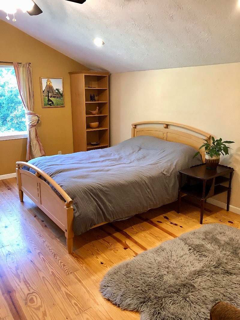 Bedroom #2, queen bed and cozy relaxing space. This room also looks out over the backyard and forest.