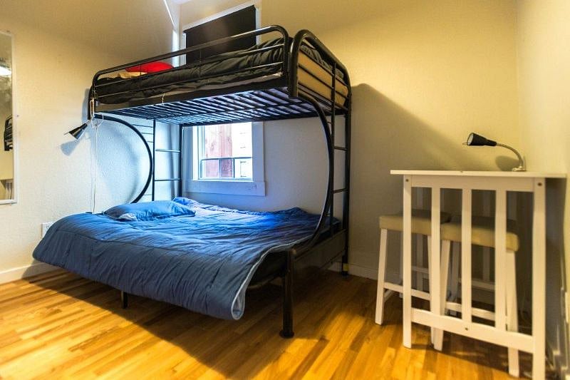 Bedding and room essentials are provided