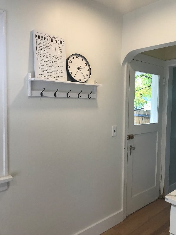 Back kitchen entrance leads to enclosed mud room