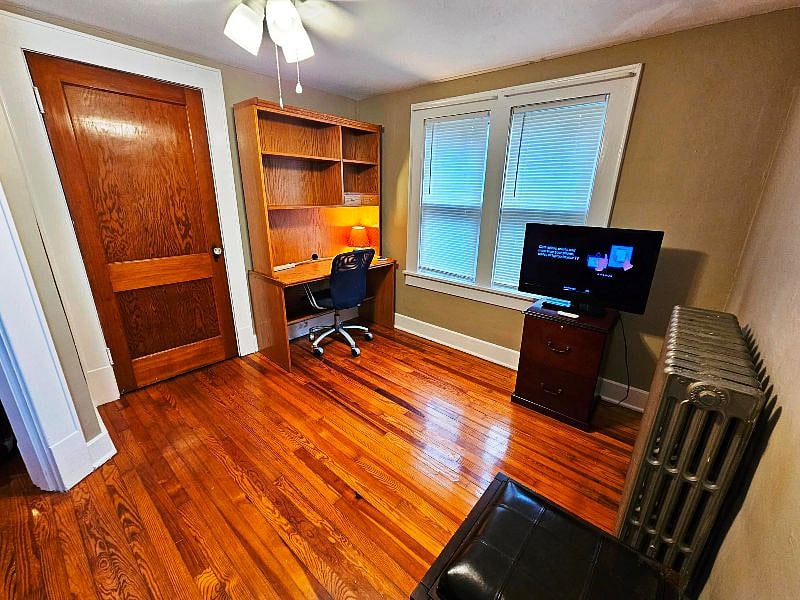 Office with desk & hutch, sofa, and tv