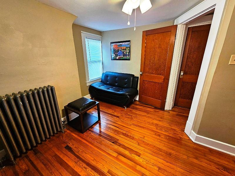 Office with desk & hutch, sofa, and tv
