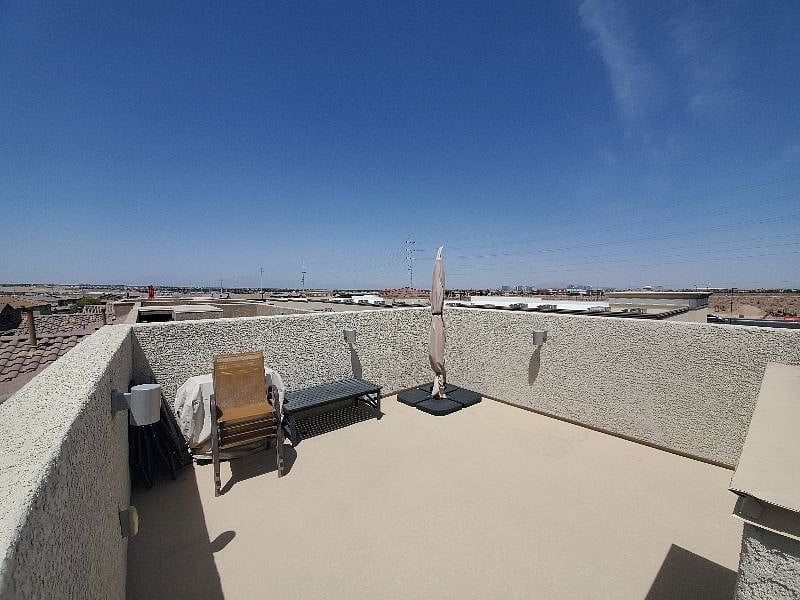 Rooftop Deck with views of the strip to one side and mountains to the opposite side.