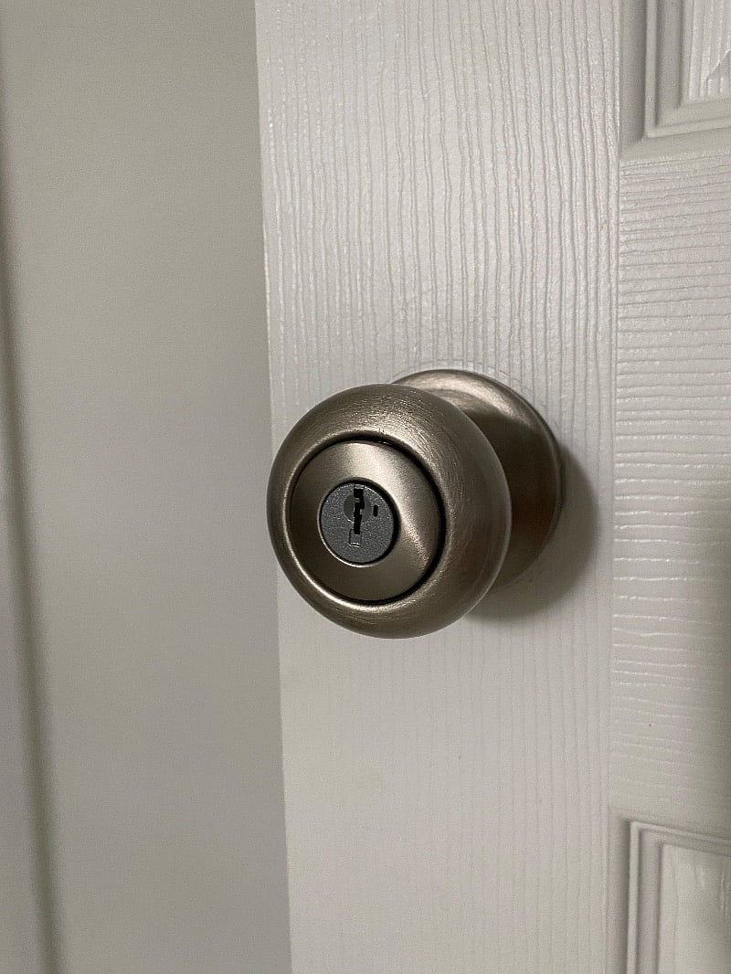 The bedroom door locks with a key.