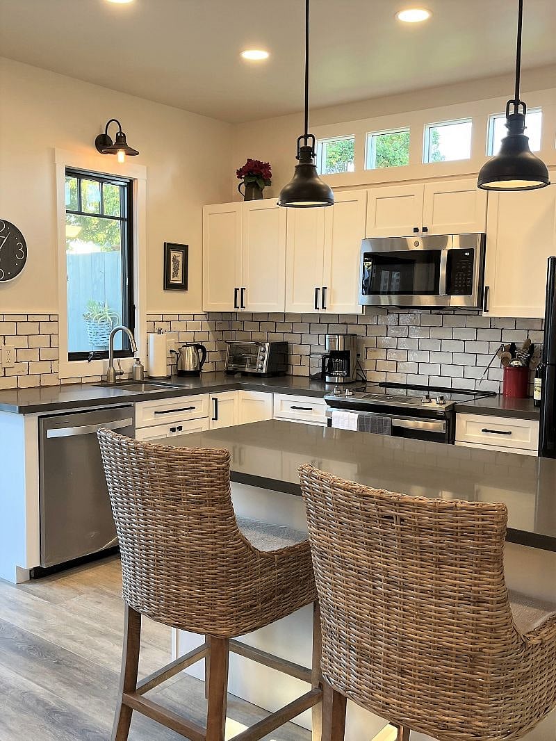 Farmhouse Kitchen with beautiful Quartz counters for cooking, eating or work space. 