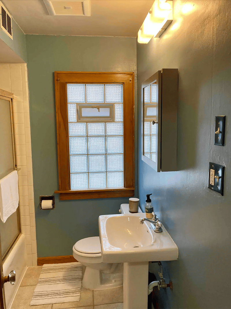 Bathroom with shower/tub. Note unit has it's own hot water heater.