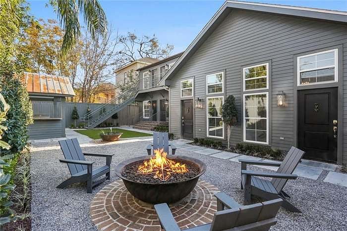 Common area large gas firepit with adirondack chairs