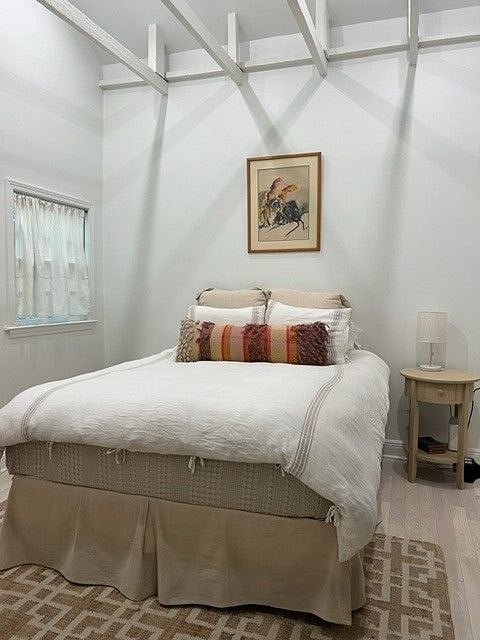 Spacious bedroom with a queen sized bed and a dresser