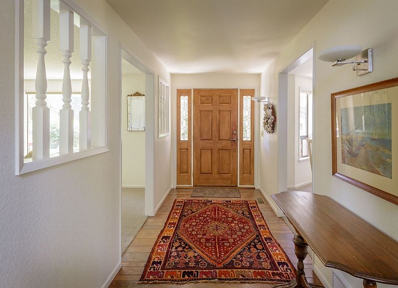 Front entry between living and dining rooms.