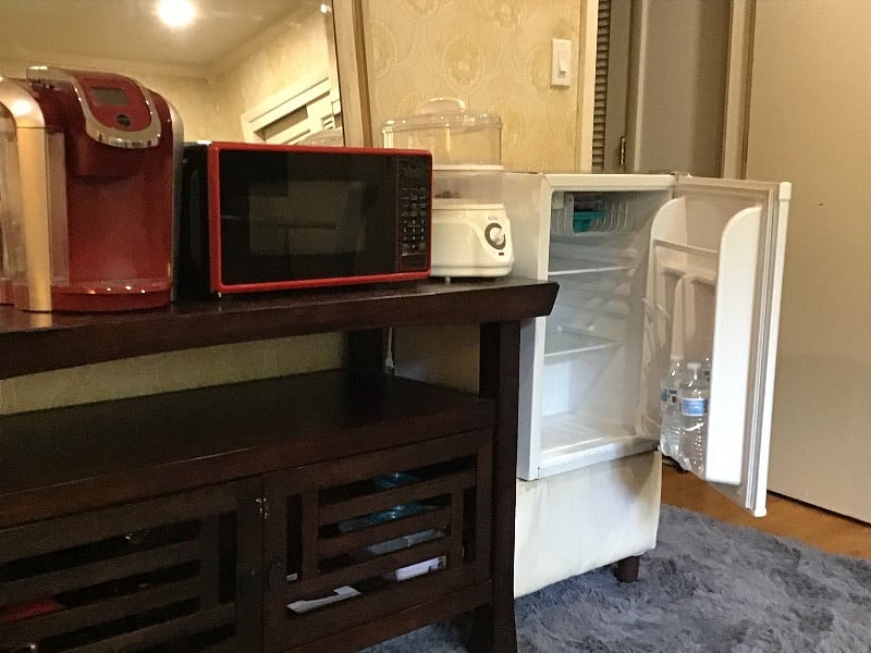 Larger fridge & micro than shown. Also has crock pot, toaster oven, juicer, more appliances.