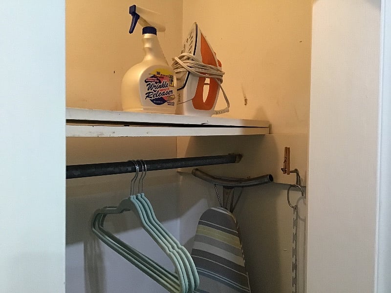 Full-sized ironing board, hand vac, broom/pan, supplies in closet.