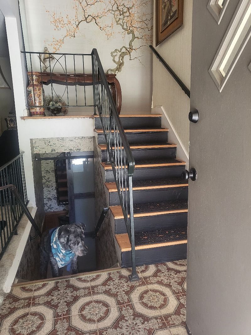 Entry w/security cam. Locked door to my home downstairs. Yours is upstairs.