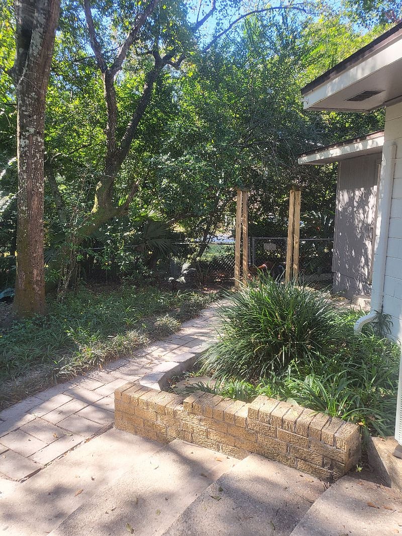 Gate from yard toward driveway & parking.