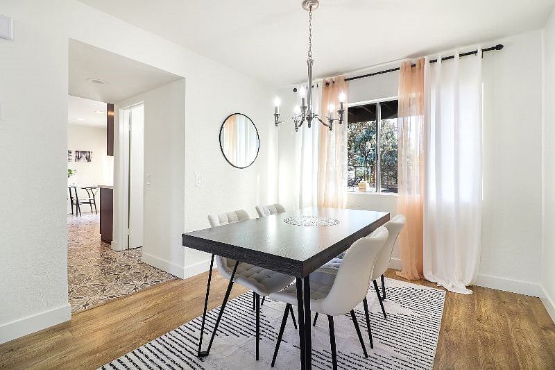 Gather around the table and savor the beauty of modern design in this stunning dining room - where every meal is a feast for the eyes and the senses.