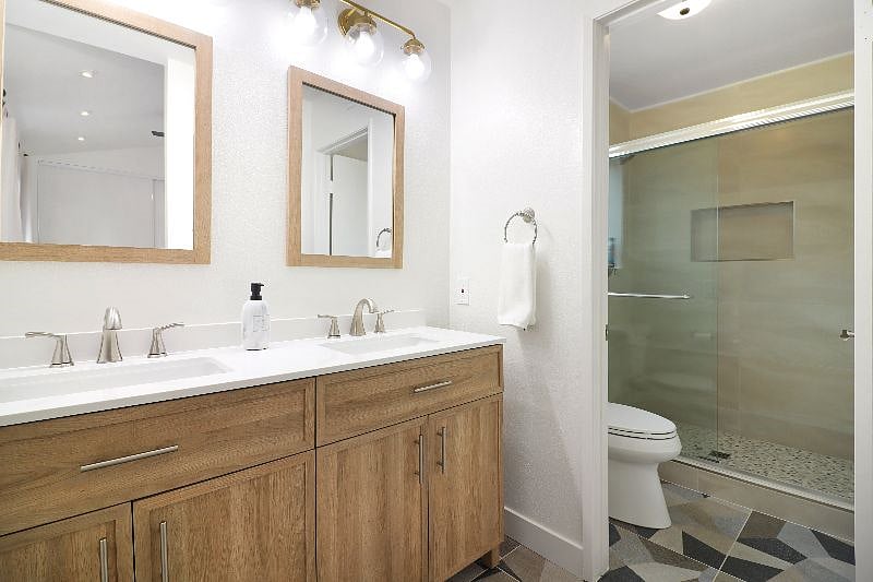 Transform your daily routine into a spa-like experience in this updated and stylish en-suite with walk in shower