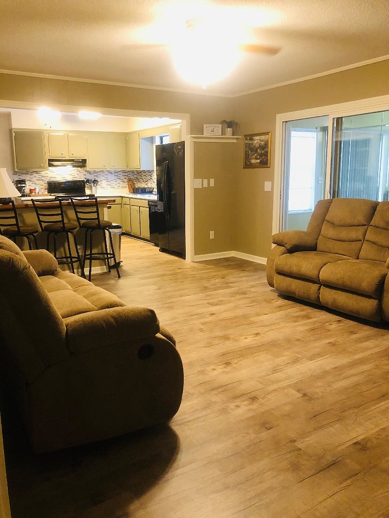 Family room looking into the kitchen on left and sunroom on right.