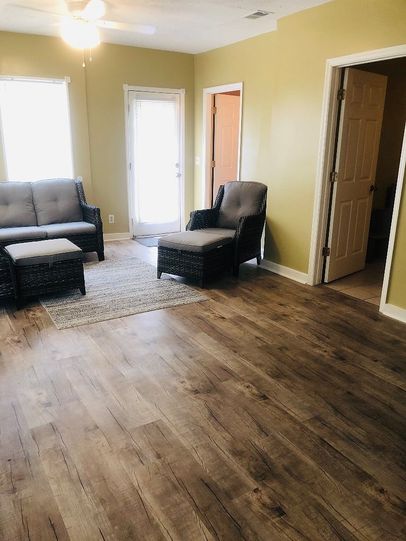 Georgia room/sunroom. To the right is the 4th bedroom/mini gym/gaming room and the 3rd bathroom is toward the back of this photo. all of this overlooks the pool in the back yard.