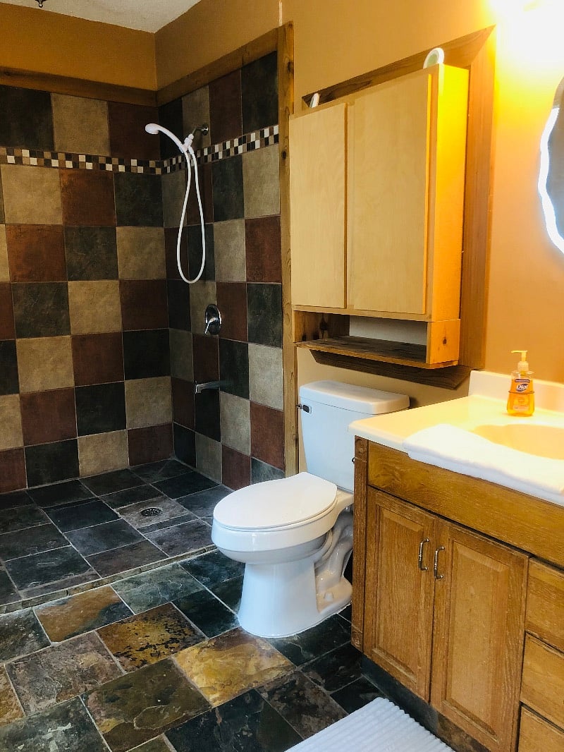 3rd bathroom with a walk-in open shower.