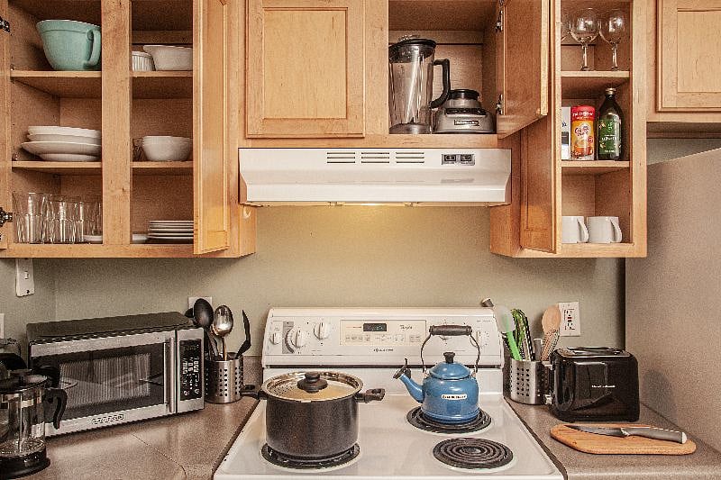 Kitchen fully stocked for cooking and dining