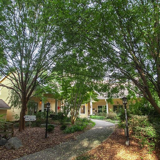 Laundry room is in this building, a short walk along a wooded path from the apartment.
