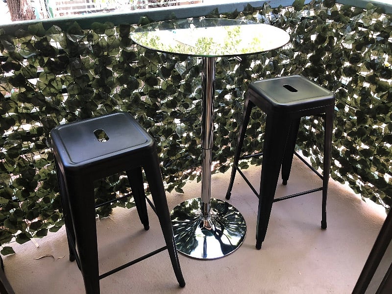 Glass table can go inside or out on the patio