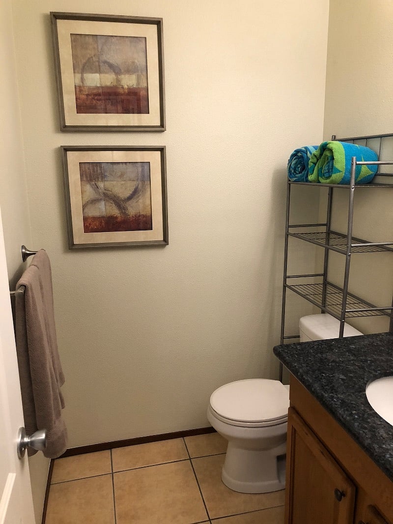 Downstairs half bath, beside kitchen and washer dryer