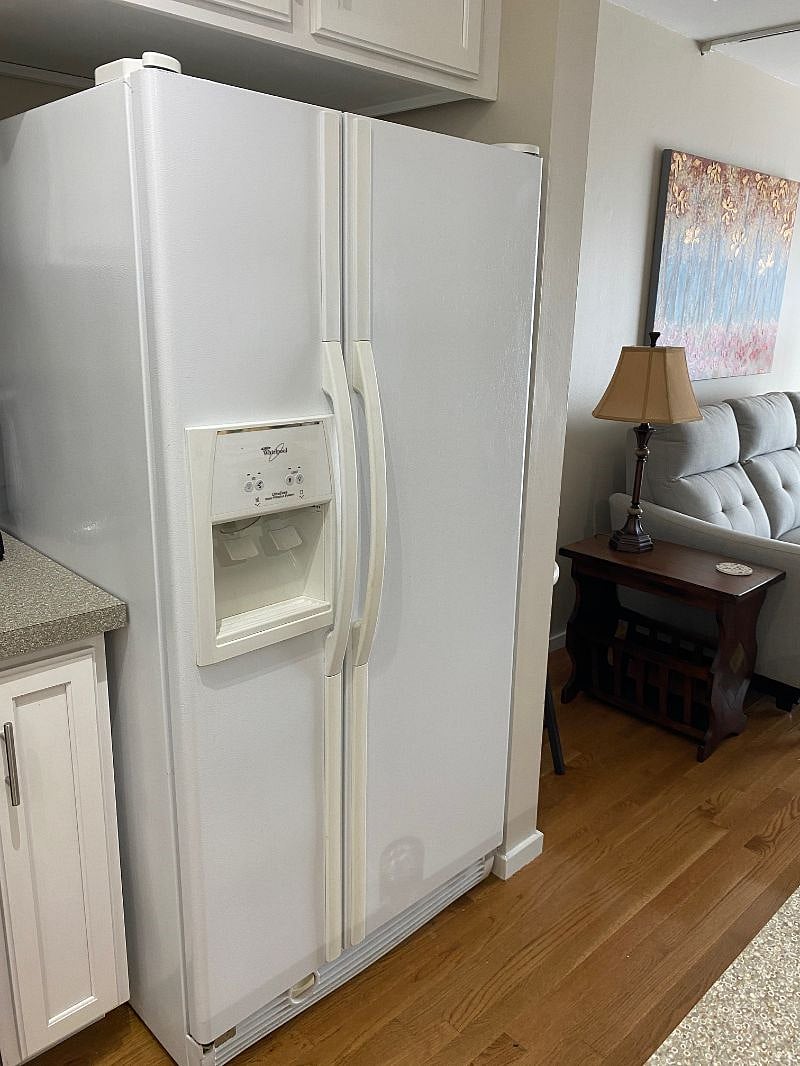 The refrigerator features easy access to ice and water.