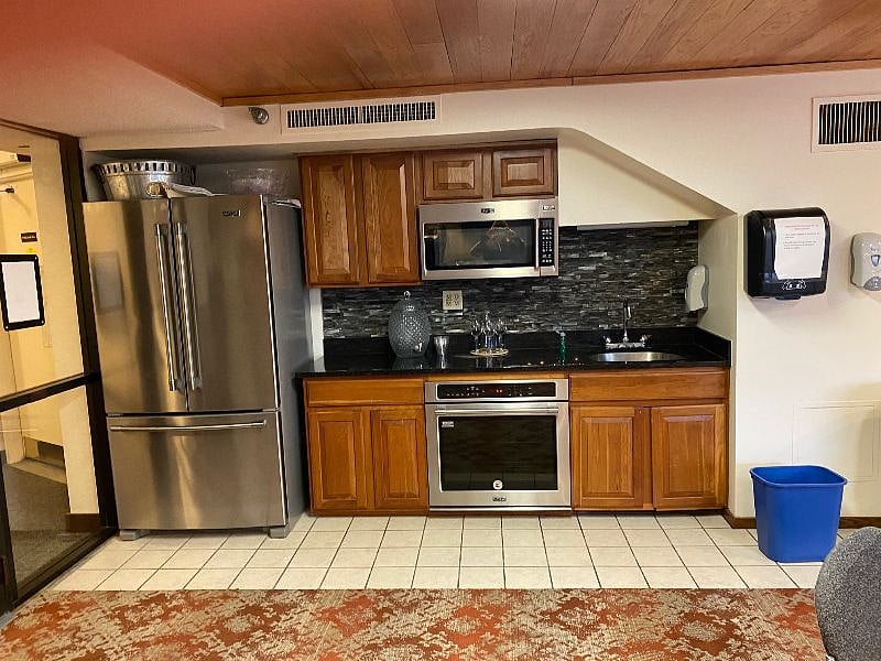 The building has a community room with a kitchen and meeting area.