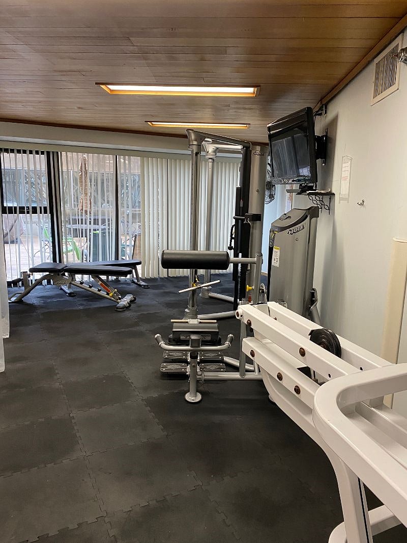 The workout room offers TVs, a spa whirlpool and sauna.