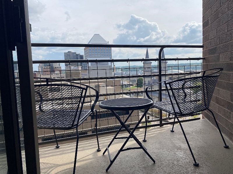 The unit's small deck looks out towards downtown Saint Paul. 