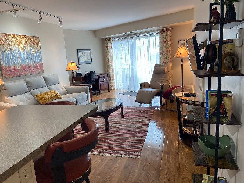 The open concept allows room for a desk area, living space and kitchen dining.
