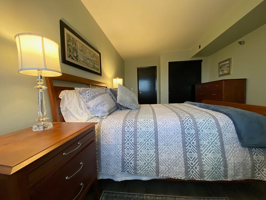 The bedroom is spacious and offers plenty of storage for personal items.