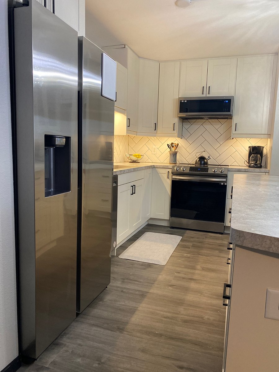 The refrigerator with exterior ice/water dispenser, an ultra-quiet dishwasher, induction range  mini-microwave hood, and counter space makes for a wonderful kitchen to enjoy home-cooked (or warmed up) meals!
