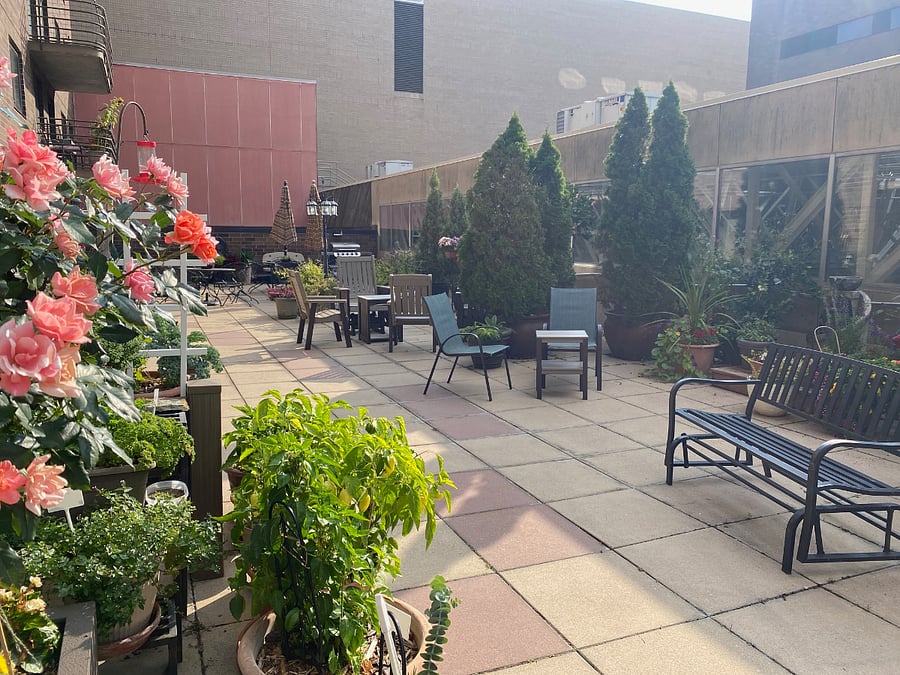 The patio offers a variety of different tables and chairs/seats for which to sit.