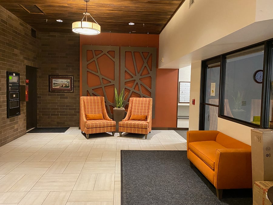 The foyer on the first level welcomes residents and their guests.  Access to units are via two elevators.
