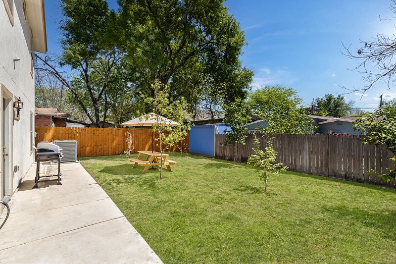 Backyard with propane grill and picnic table