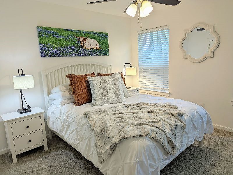 Guest bedroom features a queen bed with large walk-in closet, a TV with HULU and Netflix streaming (paid for) and access to the patio.