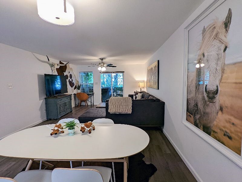 Living and dining rooms with view to patio