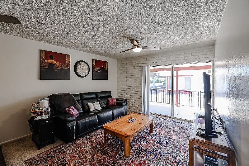 Living Room with Leather Recliner/Couch.  Both Ends Fully Recline And Can Be Used For Additional Sleeping Space.