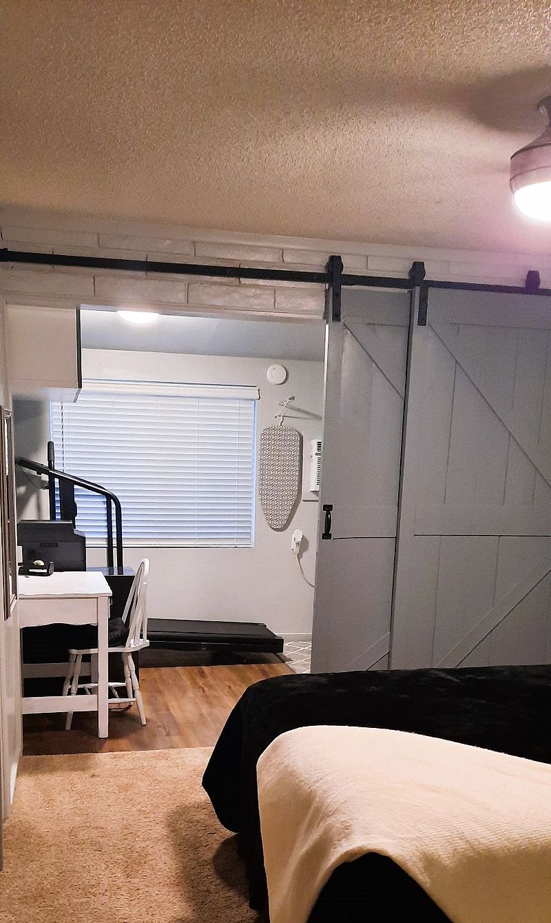 Work Space With Printer/Scanner, Filing Cabinet, Treadmill, And Laundry Area