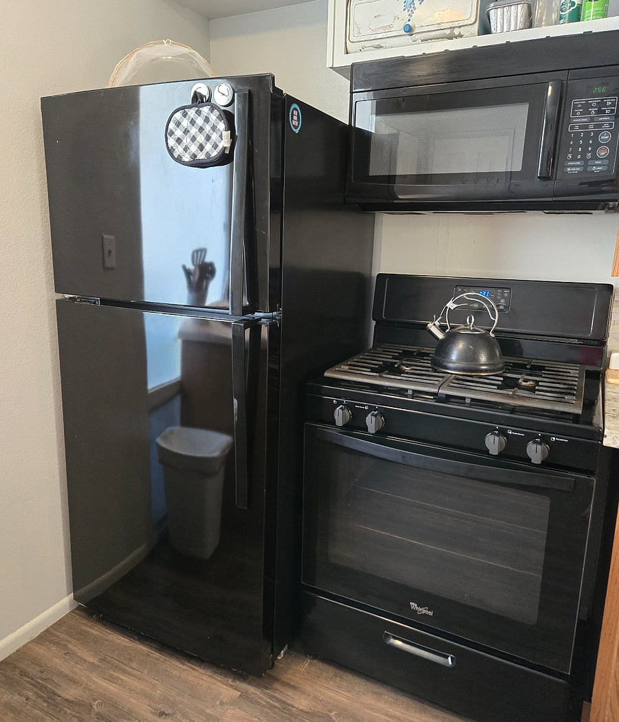 Gas oven/range, and full sized refrigerator.