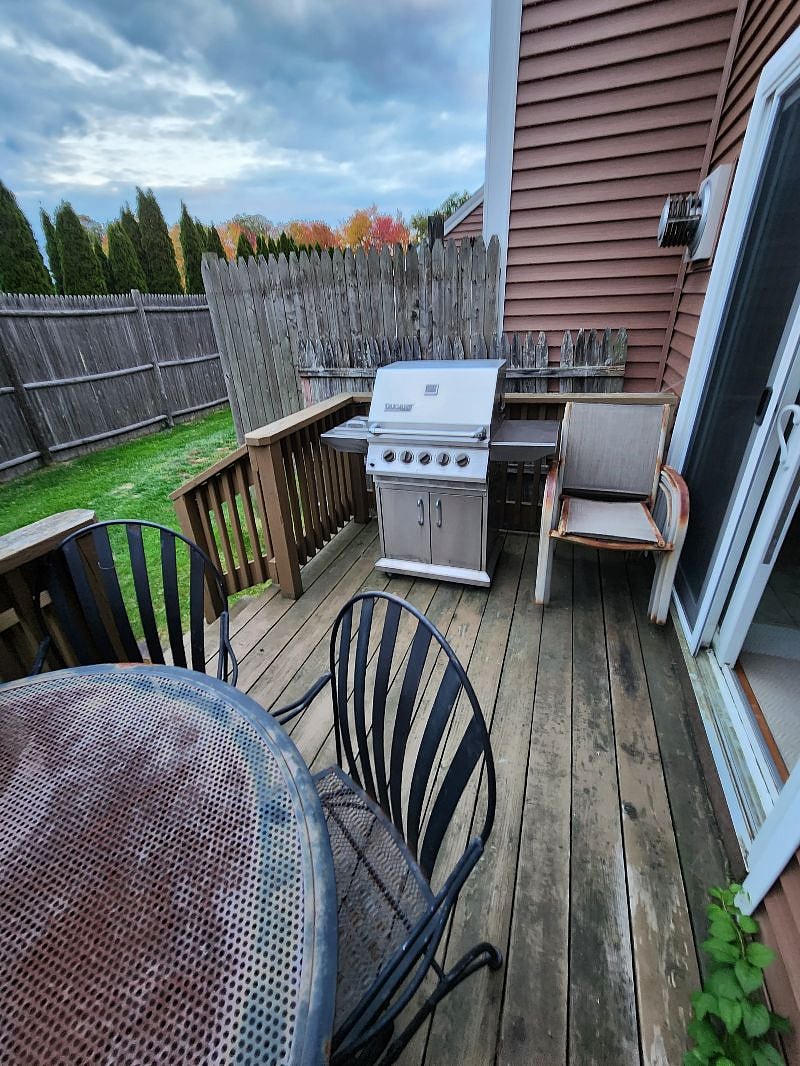 BACK DECK THROUG SLIDING DOOR IN KITCHEN WITH PROPANE GAS GRILL
