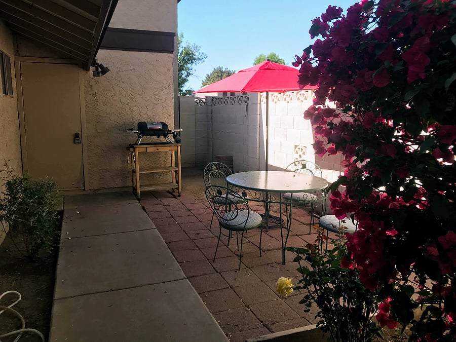 Enclosed courtyard with BBQ and storage room