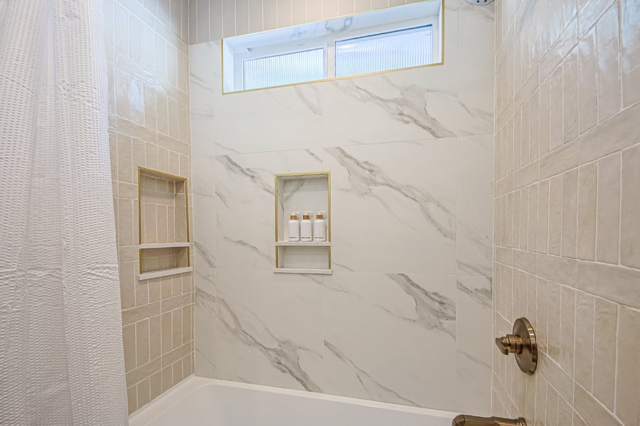 Secondary Bathroom with a soaking tub accessible from main living space