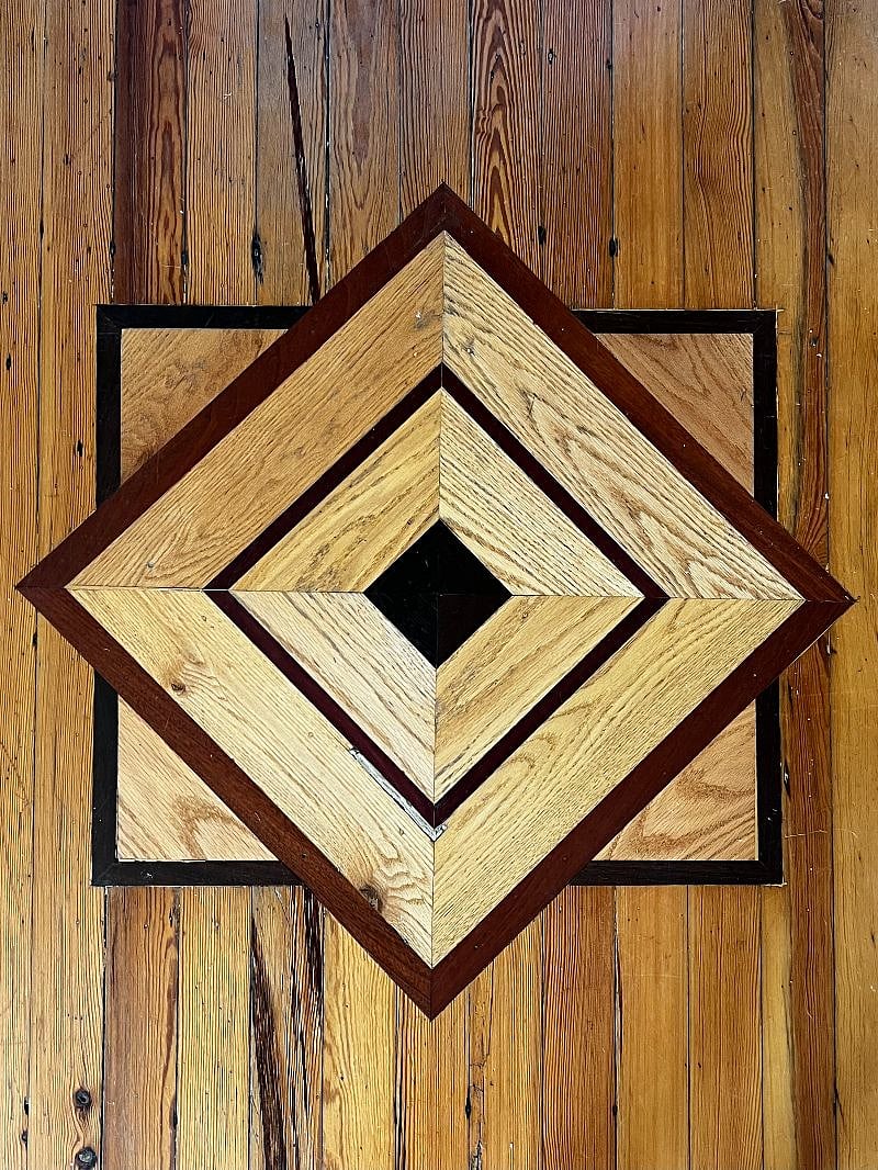 Original hardwood floors with beautiful detailing.