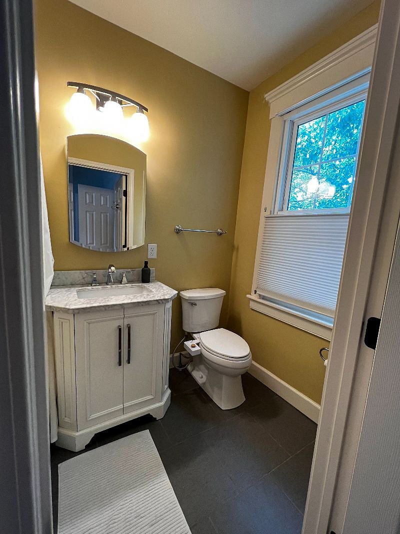 Upstairs bathroom looking out onto the backyard.