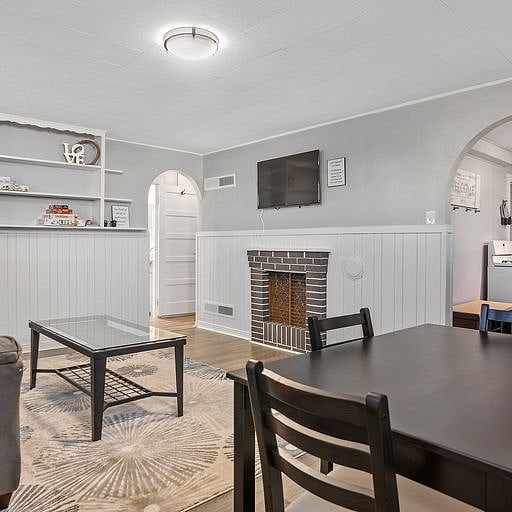 The basement includes a dining area with a table, perfect for meals, working from home, or planning your week.
