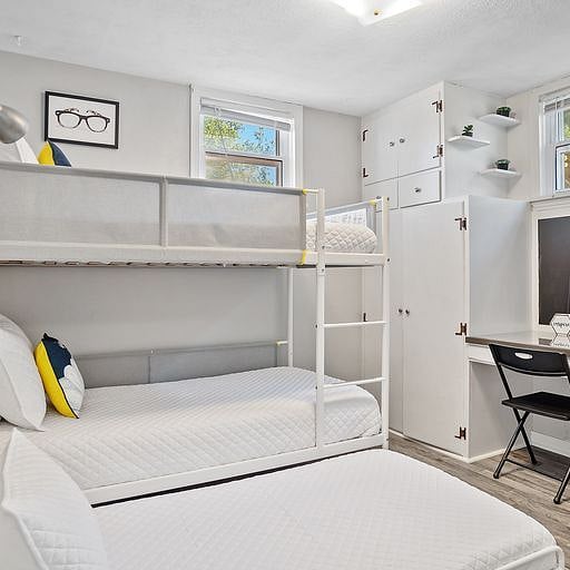 . One of the bedrooms features a bunk bed with computer station, perfect for remote work, studying, or keeping connected while on the go.