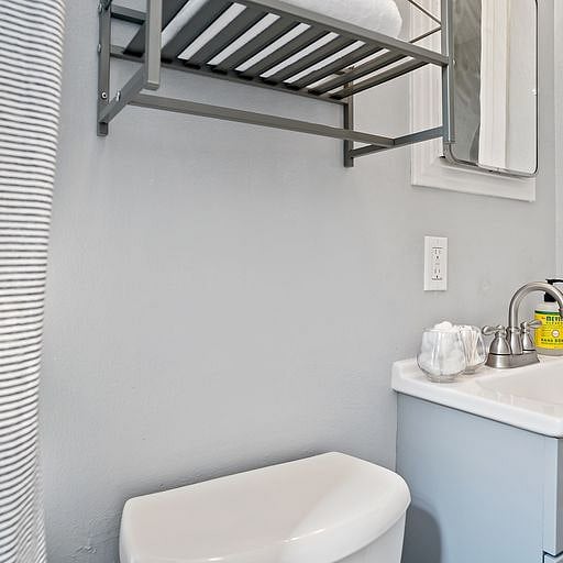The unit features a full, private bathroom designed for both comfort and convenience. I