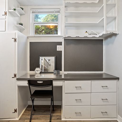 It also includes a vanity, providing a private space for getting ready or organizing your personal items.