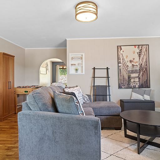 Step into the comfortable and inviting living roomthe perfect place to relax after a long day.